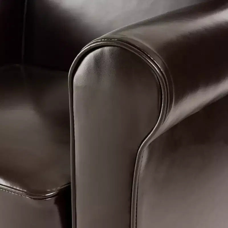 Fauteuil club contemporain rembourré à accoudoirs roulés